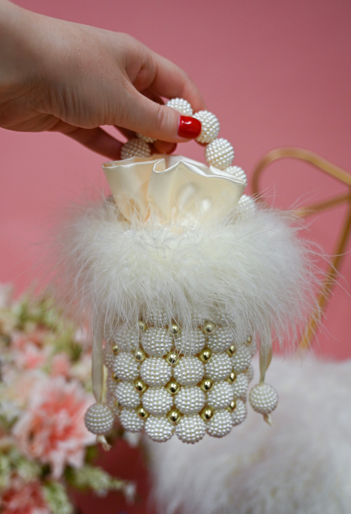 Pearl bag with white feather